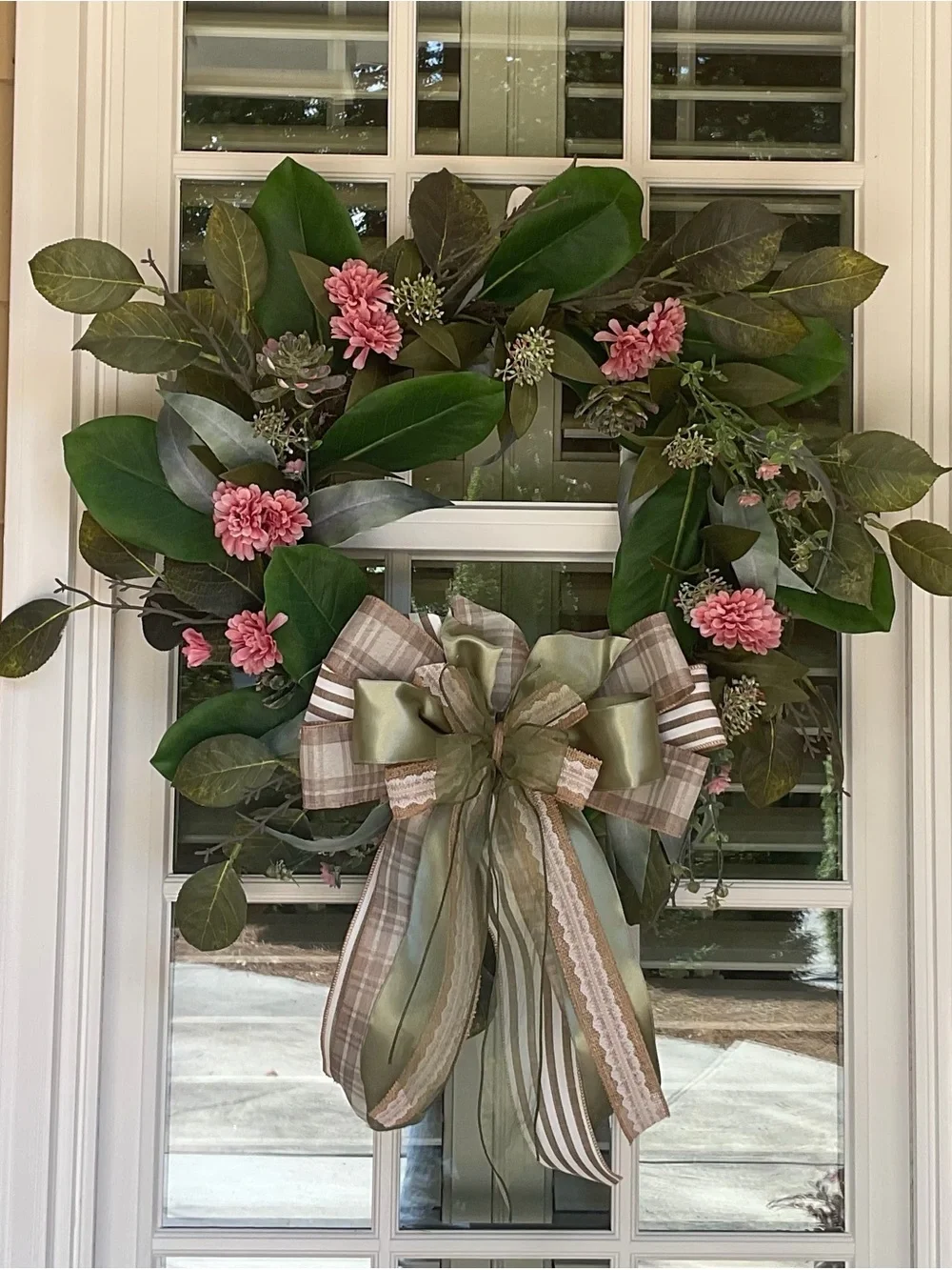 Elegant Magnolia Leaf Wreath with Pink Blossoms and Ribbon Bow